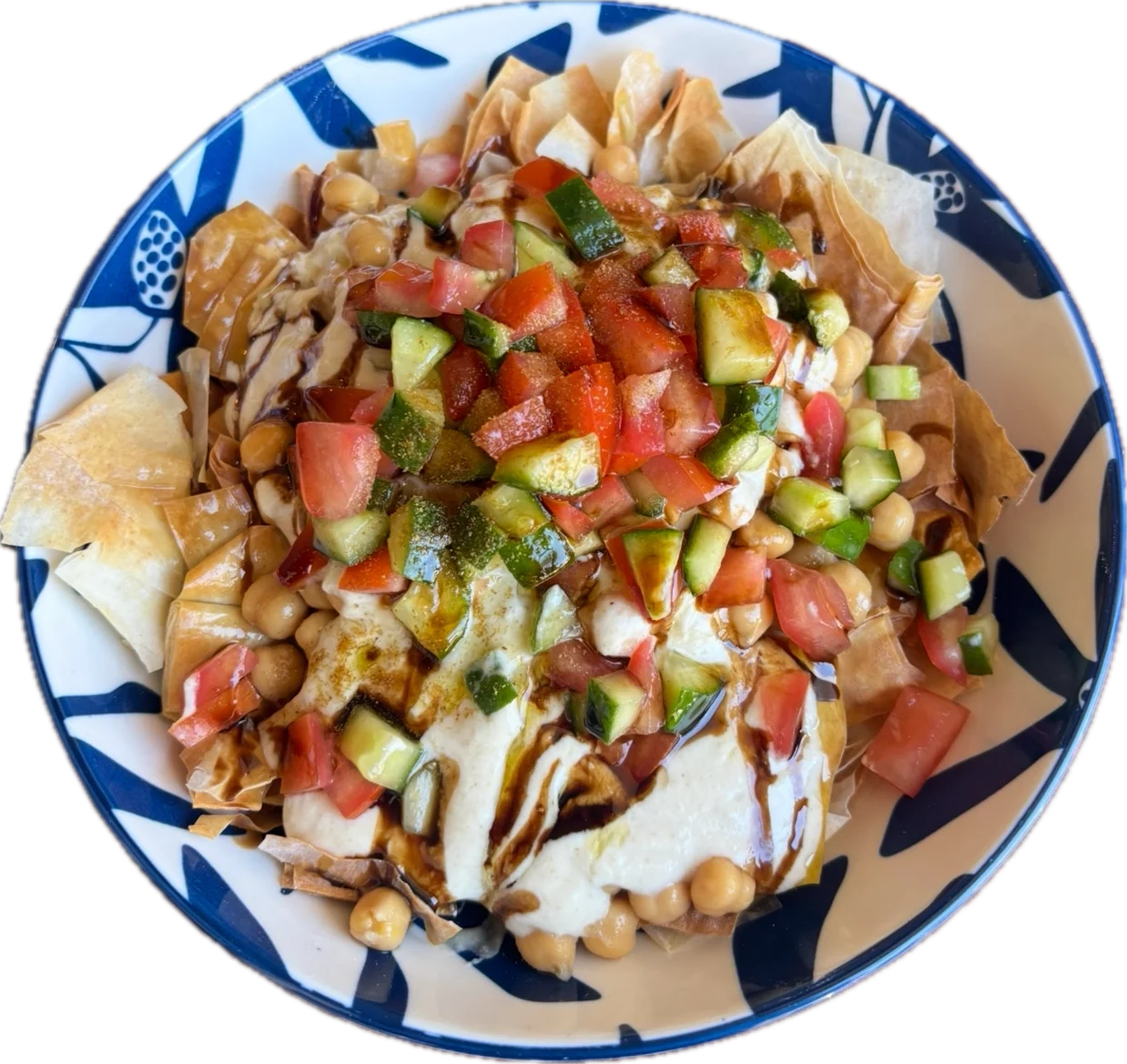 Kolaj Chickpeas Fatteh - Warm chickpeas, flaky filo, creamy yogurt tahini sauce, tomato, garlic, lemon, olive oil, parsley, and toasted nuts.
