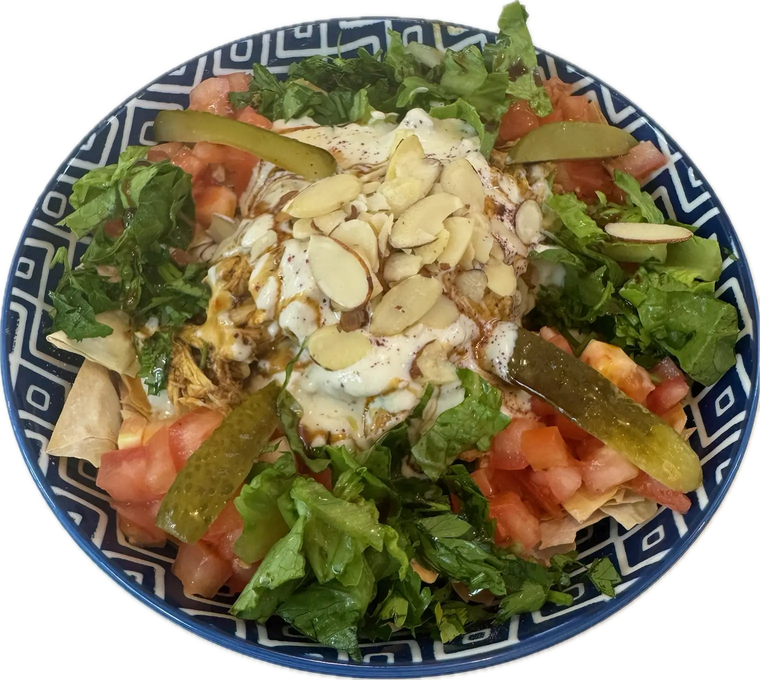 Kolaj Protein Fatteh - Off your choice (Chicken or Falafel), with creamy yogurt tahini sauce, tomato, garlic, lemon, olive oil, parsley, flaky filo, and toasted nuts .